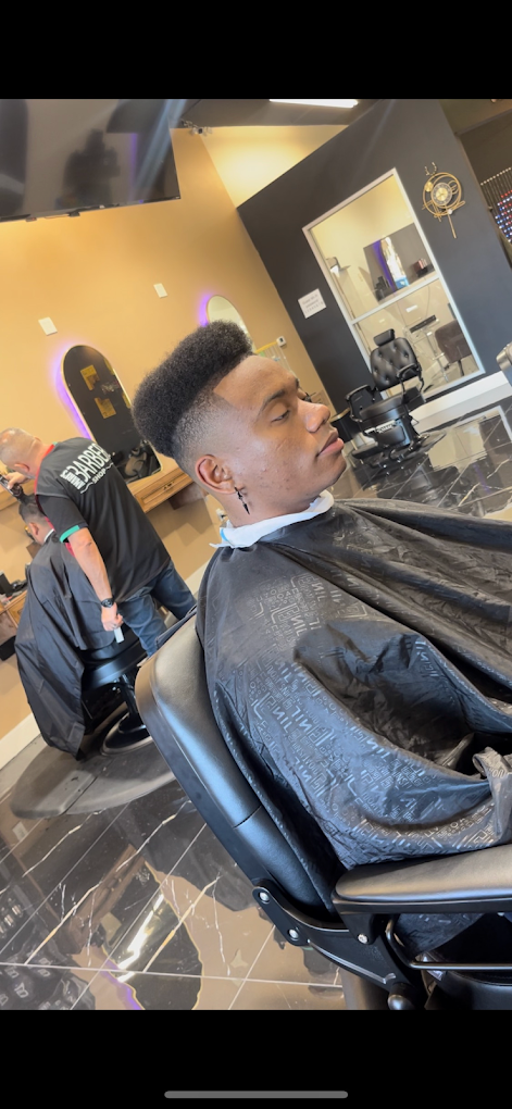 High top fade in the barber chair