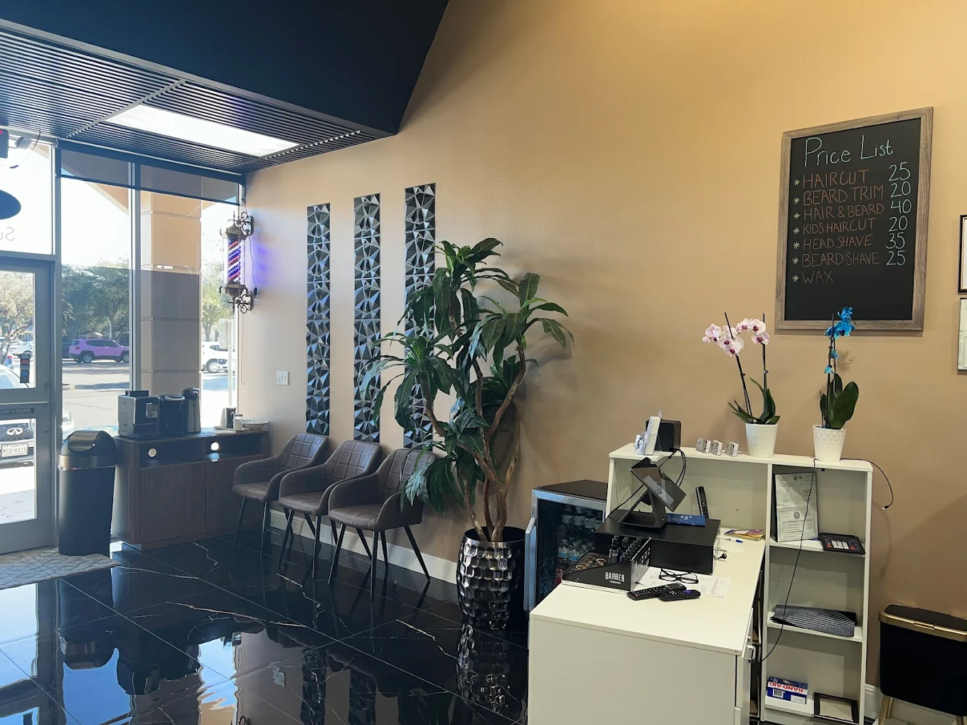 Comfortable lobby seating inside Amari's Barbershop